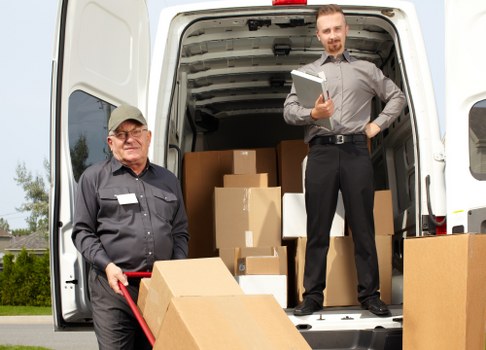 Packing team organizing fragile items for a Gunnersbury relocation