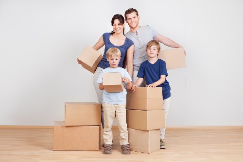 Professional movers packing furniture for a local relocation