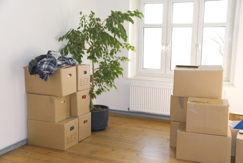 Packed boxes and furniture prepared for a flat move in Gunnersbury
