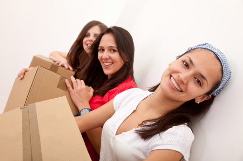 Busy moving day with removal van and packed boxes in Gunnersbury